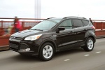 Picture of a driving 2015 Ford Escape in Tuxedo Black from a front left three-quarter perspective