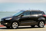 Picture of a driving 2015 Ford Escape in Tuxedo Black from a side perspective