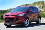 Picture of a 2015 Ford Escape Titanium 4WD in Ruby Red Tinted Clearcoat from a front left three-quarter perspective