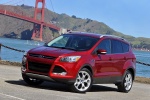Picture of a 2015 Ford Escape Titanium 4WD in Ruby Red Tinted Clearcoat from a front left three-quarter perspective
