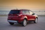 Picture of a 2017 Ford Escape Titanium in Ruby Red Metallic Tinted Clearcoat from a rear right three-quarter perspective