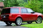 Picture of a 2015 Ford Expedition Platinum in Ruby Red Metallic Tinted Clearcoat from a rear right three-quarter perspective
