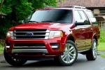 Picture of a 2015 Ford Expedition Platinum in Ruby Red Metallic Tinted Clearcoat from a front left perspective