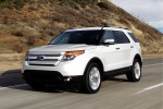 Picture of a driving 2014 Ford Explorer Limited 4WD in White from a front left three-quarter perspective