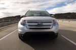 Picture of a driving 2014 Ford Explorer Limited 4WD in Ingot Silver Metallic from a frontal perspective