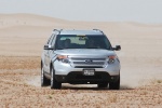 Picture of a driving 2014 Ford Explorer Limited 4WD in Ingot Silver Metallic from a frontal perspective