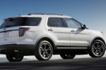 Picture of a 2014 Ford Explorer Sport 4WD in White Platinum Metallic Tri-Coat from a rear right three-quarter perspective