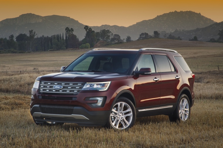 Picture of a 2016 Ford Explorer Limited 4WD in Bronze Fire Metallic Tinted Clearcoat from a front left three-quarter perspective