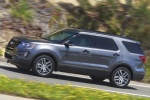 Picture of a driving 2016 Ford Explorer Sport 4WD in Magnetic Metallic from a side perspective