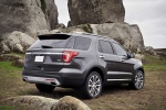 Picture of a 2017 Ford Explorer Platinum 4WD in Magnetic Metallic from a rear right three-quarter perspective