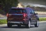 Picture of a driving 2018 Ford Explorer Limited 4WD from a rear right perspective