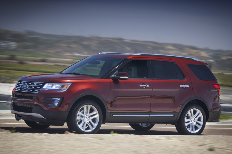 Picture of a driving 2019 Ford Explorer Limited 4WD from a front left three-quarter perspective