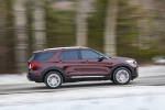 Picture of a driving 2020 Ford Explorer Platinum V6 EcoBoost 4WD in Rich Copper Metallic Tinted Clearcoat from a right side perspective