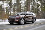 Picture of a driving 2020 Ford Explorer Platinum V6 EcoBoost 4WD in Rich Copper Metallic Tinted Clearcoat from a front left three-quarter perspective