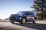 Picture of a driving 2020 Ford Explorer Limited in Atlas Blue Metallic from a front left perspective