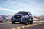 Picture of a driving 2020 Ford Explorer ST EcoBoost 4WD in Atlas Blue Metallic from a front left perspective