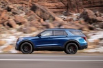 Picture of a driving 2020 Ford Explorer ST EcoBoost 4WD in Atlas Blue Metallic from a left side perspective