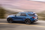 Picture of a driving 2020 Ford Explorer ST EcoBoost 4WD in Atlas Blue Metallic from a rear left three-quarter perspective