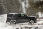 Picture of a driving 2018 GMC Yukon Denali in Onyx Black from a right side perspective