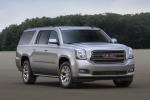 Picture of a 2018 GMC Yukon XL in Quicksilver Metallic from a front right three-quarter perspective