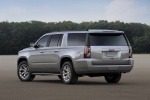 Picture of a 2018 GMC Yukon XL in Quicksilver Metallic from a rear left three-quarter perspective
