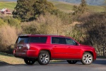 Picture of a 2018 GMC Yukon XL Denali in Red from a rear right three-quarter perspective