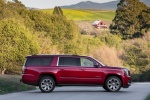 Picture of a 2018 GMC Yukon XL Denali in Red from a side perspective