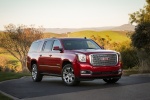 Picture of a 2018 GMC Yukon XL Denali in Red from a front right three-quarter perspective