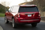 Picture of a 2018 GMC Yukon XL Denali in Red from a rear left perspective