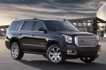 Picture of a 2018 GMC Yukon Denali in Onyx Black from a front right three-quarter perspective