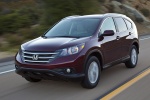 Picture of a driving 2014 Honda CR-V EX-L AWD in Basque Red Pearl II from a front left perspective