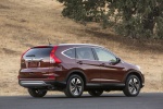 Picture of a 2015 Honda CR-V Touring AWD in Basque Red Pearl II from a rear right three-quarter perspective