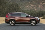 Picture of a 2015 Honda CR-V Touring AWD in Basque Red Pearl II from a side perspective