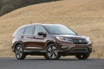 Picture of a 2015 Honda CR-V Touring AWD in Basque Red Pearl II from a front right three-quarter perspective