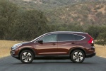 Picture of a 2015 Honda CR-V Touring AWD in Basque Red Pearl II from a side perspective