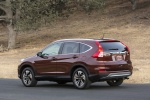 Picture of a 2015 Honda CR-V Touring AWD in Basque Red Pearl II from a rear left three-quarter perspective