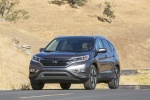 Picture of a driving 2016 Honda CR-V Touring in Modern Steel Metallic from a front left perspective