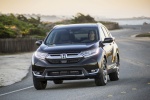 Picture of a driving 2017 Honda CR-V Touring AWD in Crystal Black Pearl from a front left perspective