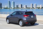 Picture of a driving 2016 Honda HR-V AWD in Modern Steel Metallic from a rear left three-quarter perspective