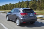 Picture of a driving 2016 Honda HR-V AWD in Modern Steel Metallic from a rear left perspective