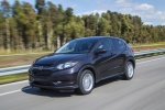 Picture of a driving 2017 Honda HR-V in Mulberry Metallic from a front left three-quarter perspective
