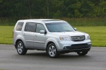 Picture of a 2014 Honda Pilot EX-L in Alabaster Silver Metallic from a front right three-quarter perspective