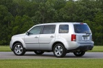 Picture of a 2014 Honda Pilot EX-L in Alabaster Silver Metallic from a rear left three-quarter perspective