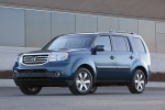 Picture of a 2014 Honda Pilot Touring in Obsidian Blue Pearl from a front left three-quarter perspective