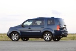 Picture of a 2014 Honda Pilot Touring in Obsidian Blue Pearl from a rear left three-quarter perspective