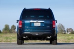 Picture of a 2014 Honda Pilot Touring in Obsidian Blue Pearl from a rear perspective