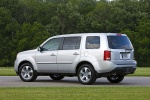 Picture of a 2015 Honda Pilot EX-L in Alabaster Silver Metallic from a rear left three-quarter perspective
