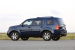 Picture of a 2015 Honda Pilot Touring in Obsidian Blue Pearl from a rear left three-quarter perspective