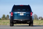 Picture of a 2015 Honda Pilot Touring in Obsidian Blue Pearl from a rear perspective