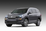 Picture of a 2016 Honda Pilot in Modern Steel Metallic from a front left perspective